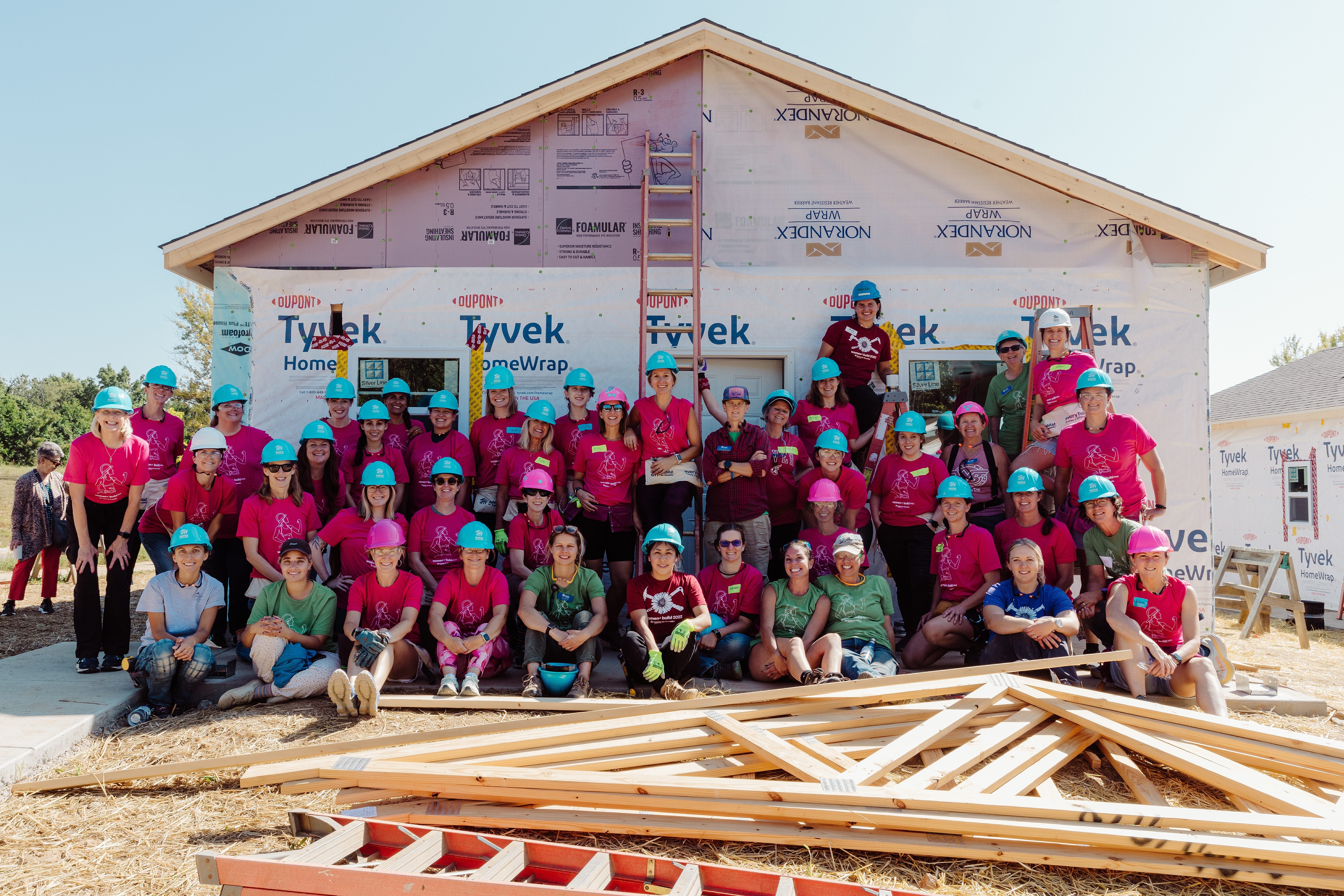 women volunteers on a house building site